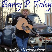 Barry P. Foley Barry P. Foley mit seiner Gitarre vor einem alten Auto